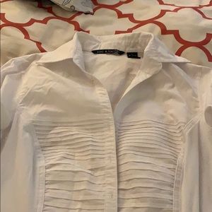 White pleated blouse